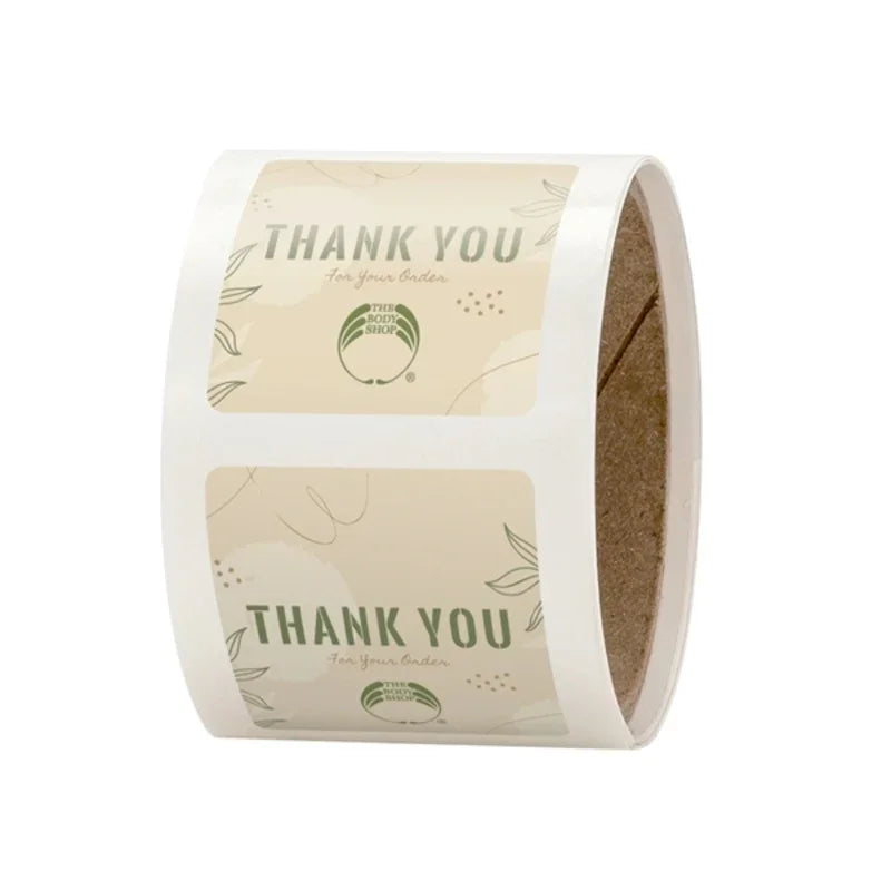 Rectangle Labels with rounded corners roll featuring beige background and green thank you text with leaf design elements