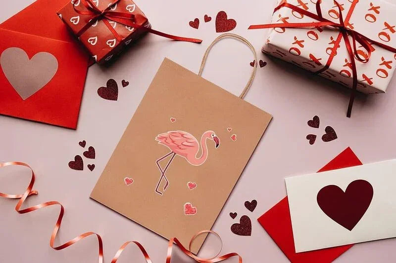 Kraft Paper Bags with handles, 8x4x10 inches, brown bag with pink flamingo design surrounded by Valentine’s Day gifts and hearts