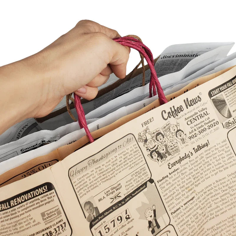 White News Paper Bags - Extra Large size (Wide Version) with red twisted handles holding folded recycled newsprint inside