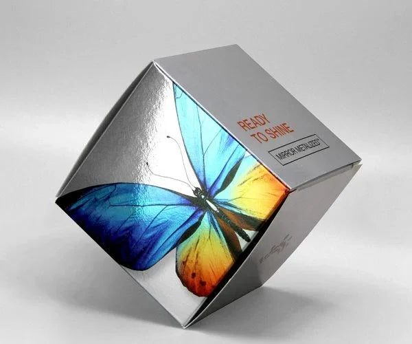 Custom Tuck End Folding Carton Boxes | Cosmetic & Retail Packaging | Eco-Friendly Printing with vibrant blue and orange butterfly design on silver box