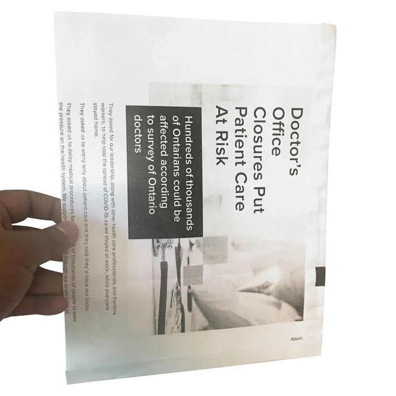 Hand holding White Newsprint - Flat bottom - Notion Paper Bags (Pouch) with black and white newsprint design