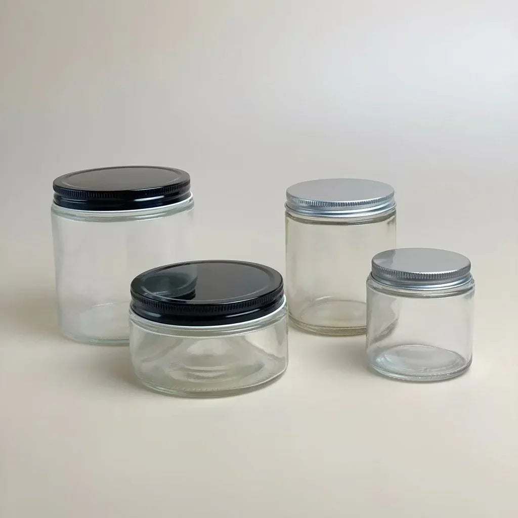 Empty Candle Jars | Wholesale Glass Containers | Eco Friendly Candle Packaging with various clear glass jars and contrasting lids